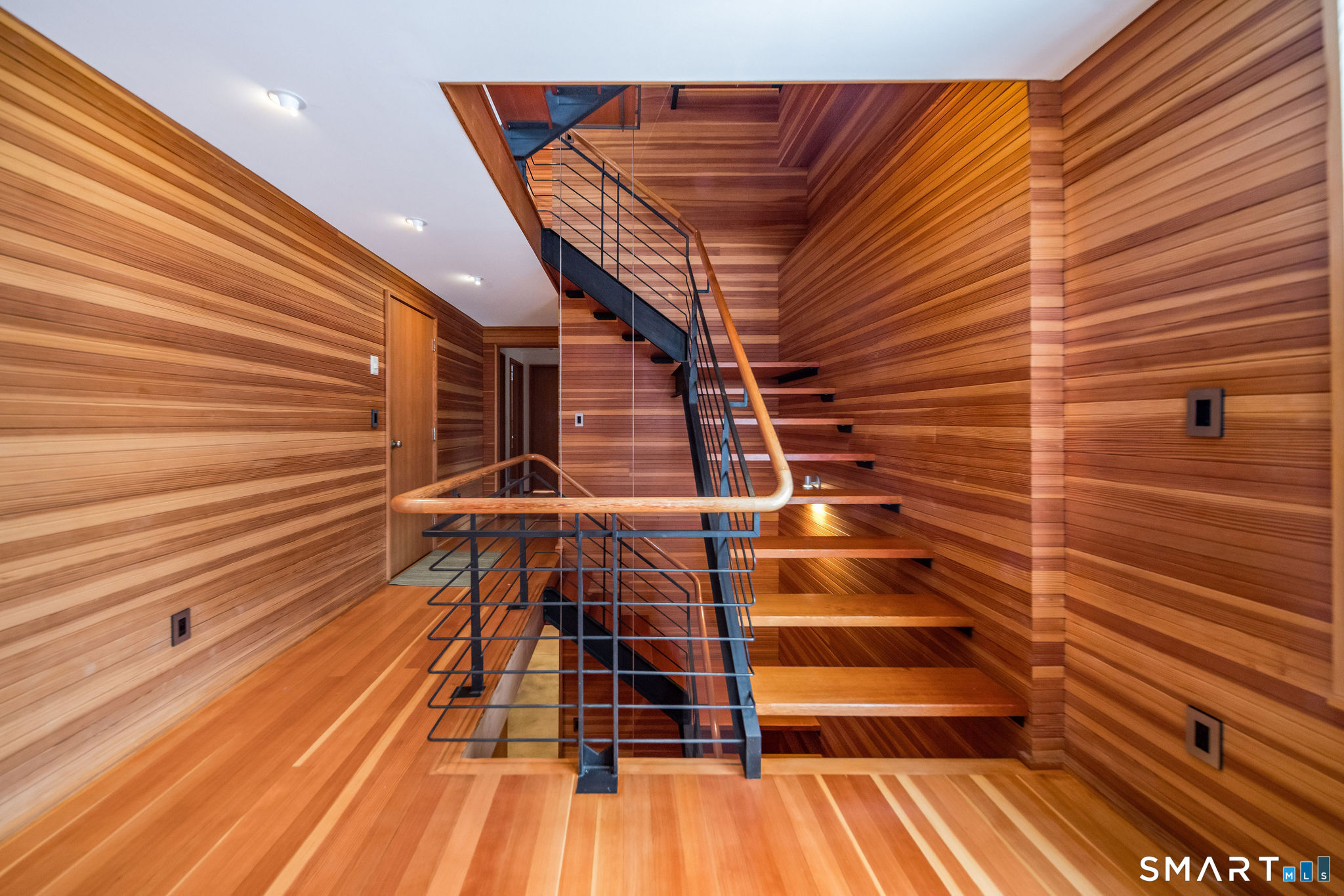 61 Hartford Avenue Madison, CT 06443 - Photo 6 of 40 a view of entryway with wooden floor
