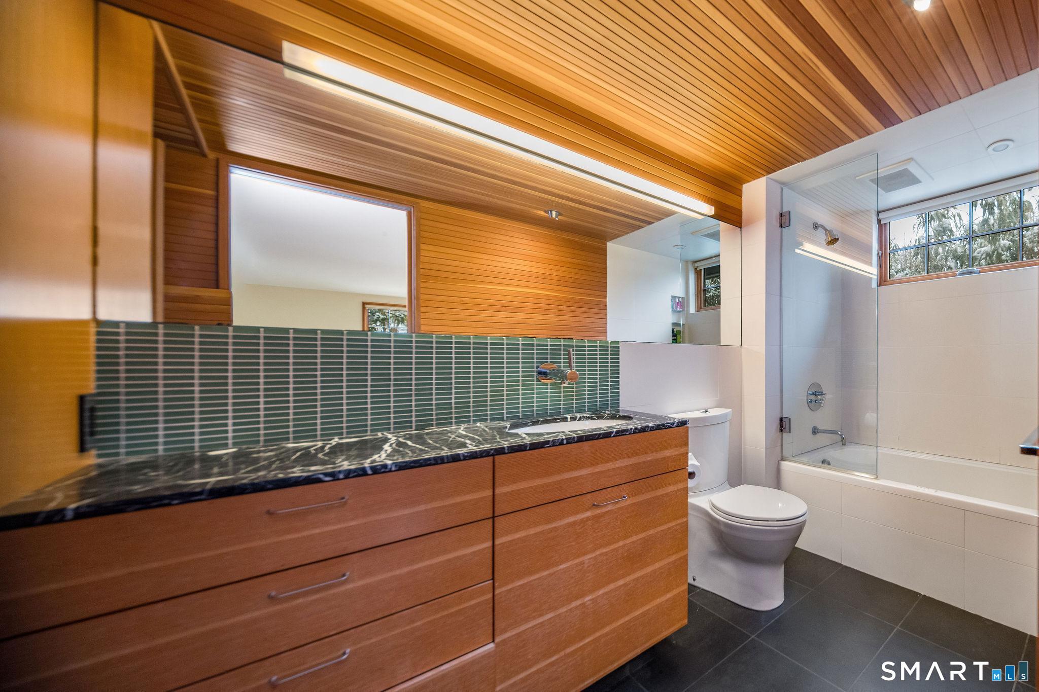 61 Hartford Avenue Madison, CT 06443 - Photo 63 of 75 a bathroom with a toilet a sink and bathtub