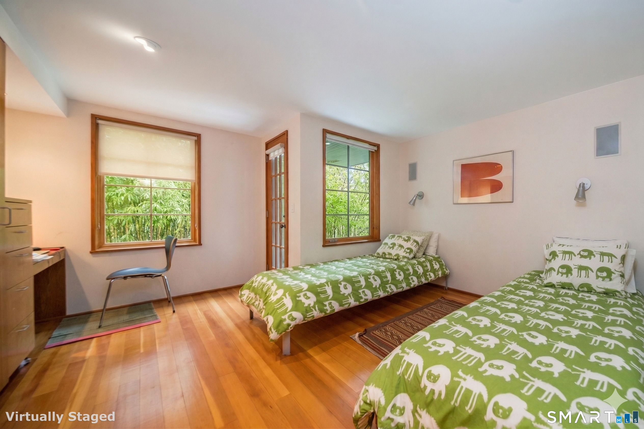 61 Hartford Avenue Madison, CT 06443 - Photo 65 of 75 a bedroom with a bed and a large window