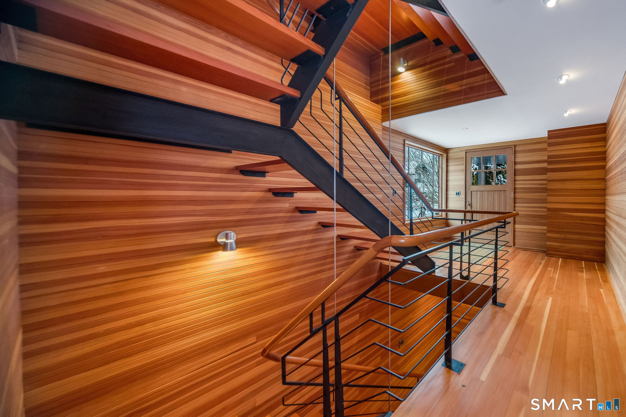 61 Hartford Avenue Madison, CT 06443 - Photo 9 of 75 a view of entryway with wooden floor