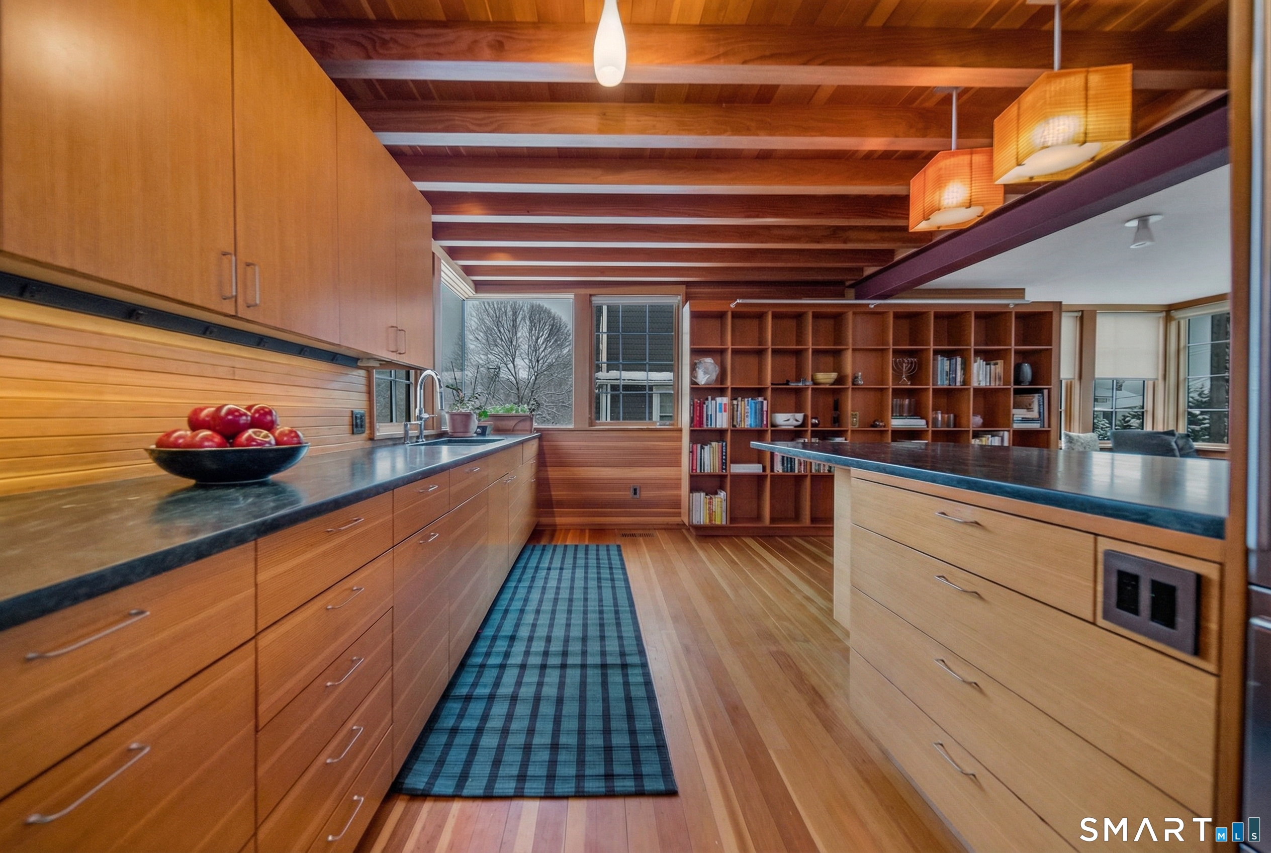 61 Hartford Avenue Madison, CT 06443 - Photo 9 of 40 a kitchen with stainless steel appliances granite countertop a stove and cabinets