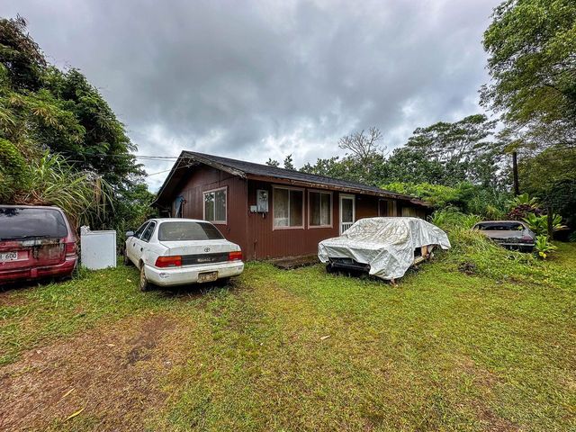 4373 Upa Road Koloa, HI 96756 - Photo 5 of 19 a car parked in front of a house with cars parked
