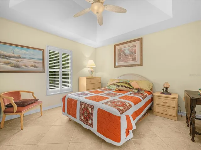 a bedroom with a bed and a chair