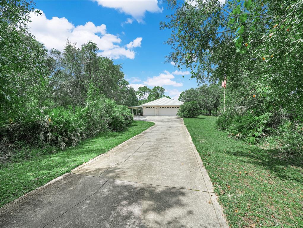 5001 Lakewood Road Sebring, FL 33875 - Photo 2 of 28 a view of a backyard with green space
