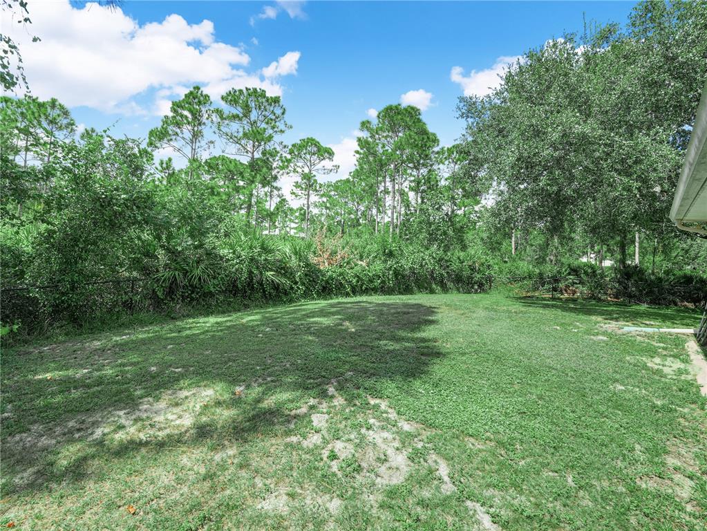 5001 Lakewood Road Sebring, FL 33875 - Photo 23 of 28 a view of a grassy field with trees