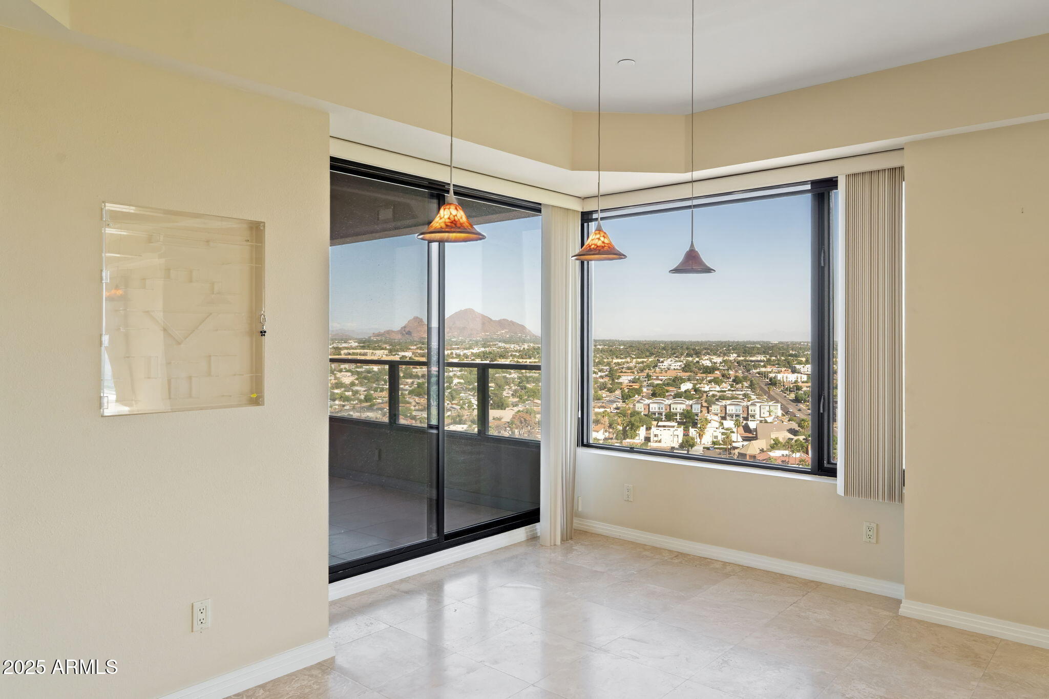 1040 East Osborn Road, Unit 1602 Phoenix, AZ 85014 - Photo 12 of 66 a view of an empty room with a window