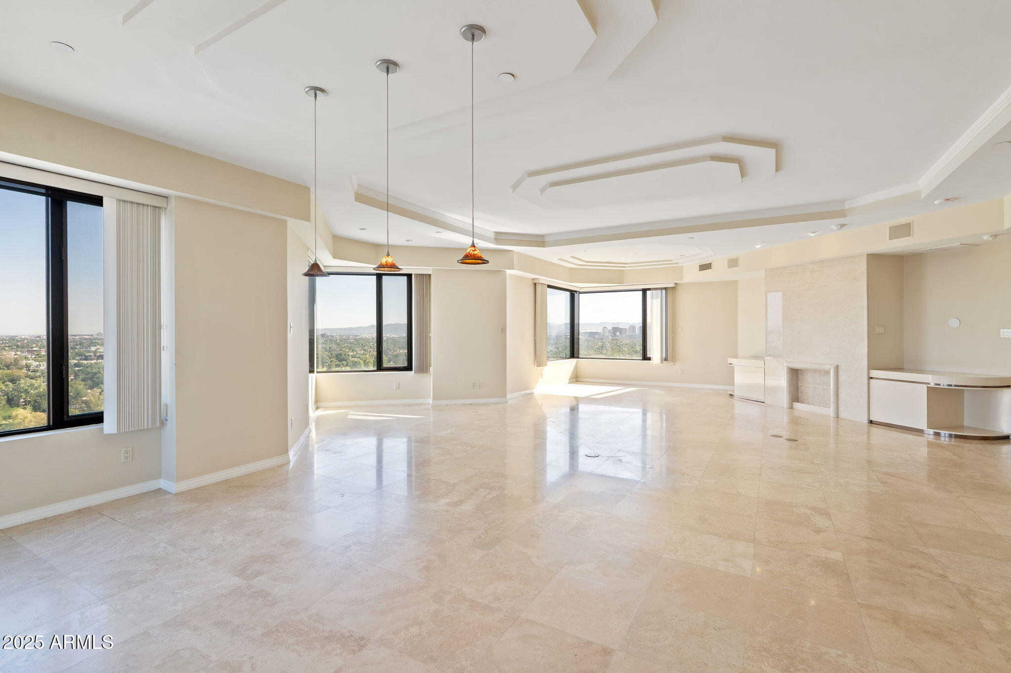 1040 East Osborn Road, Unit 1602 Phoenix, AZ 85014 - Photo 14 of 66 a view of a living room and chandelier