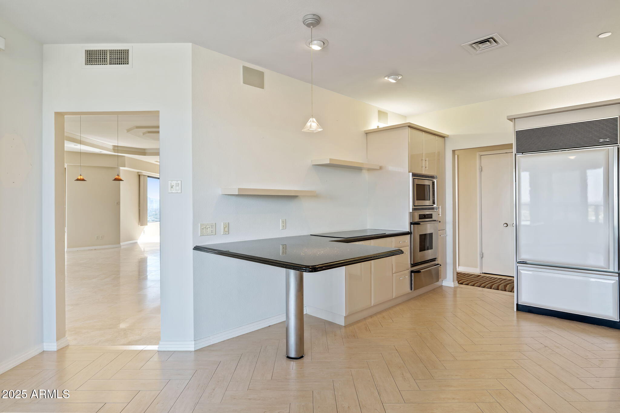 1040 East Osborn Road, Unit 1602 Phoenix, AZ 85014 - Photo 19 of 66 a kitchen with stainless steel appliances granite countertop a refrigerator and a stove