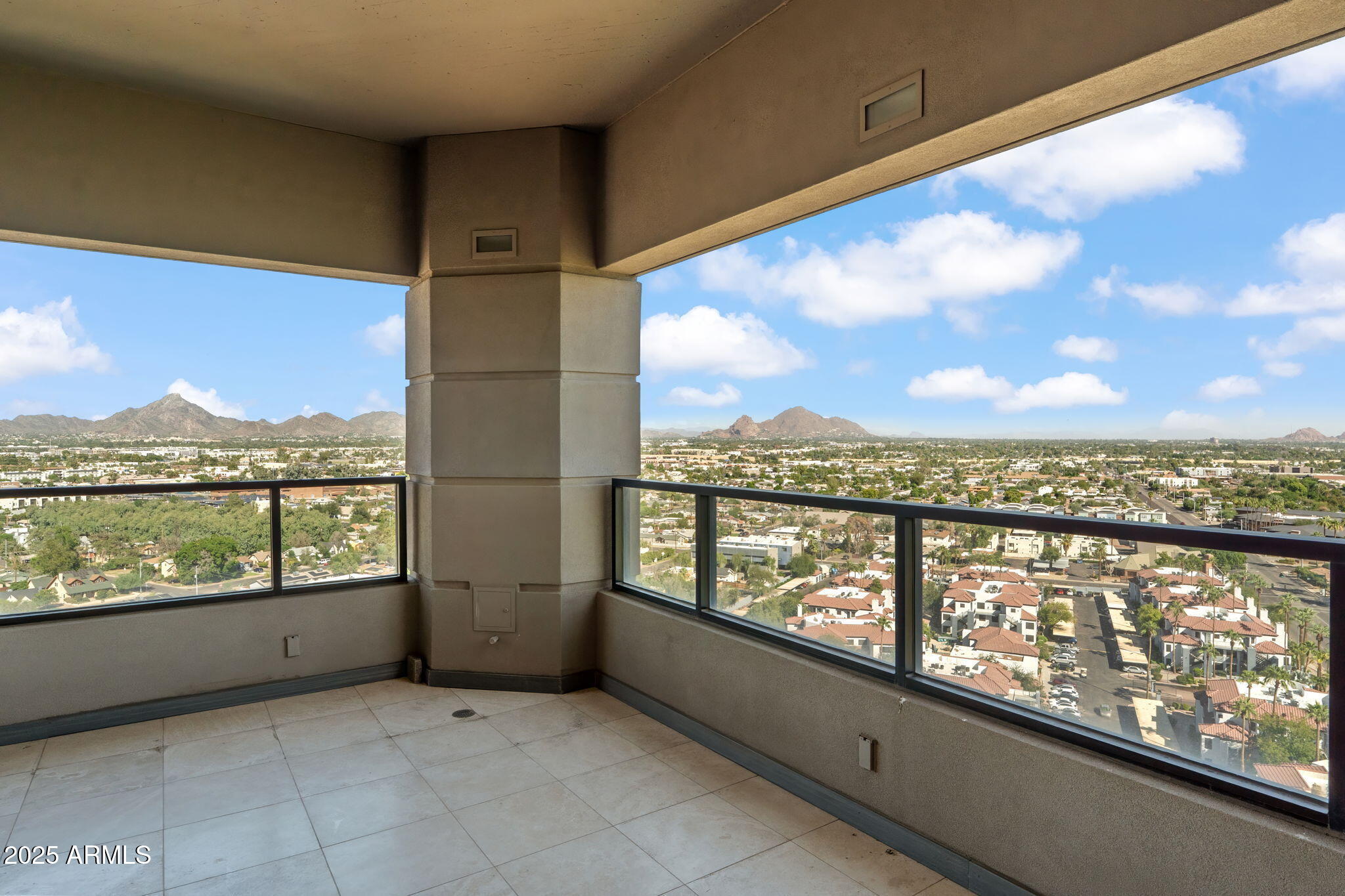 1040 East Osborn Road, Unit 1602 Phoenix, AZ 85014 - Photo 2 of 66 a view of city with a lake from a balcony