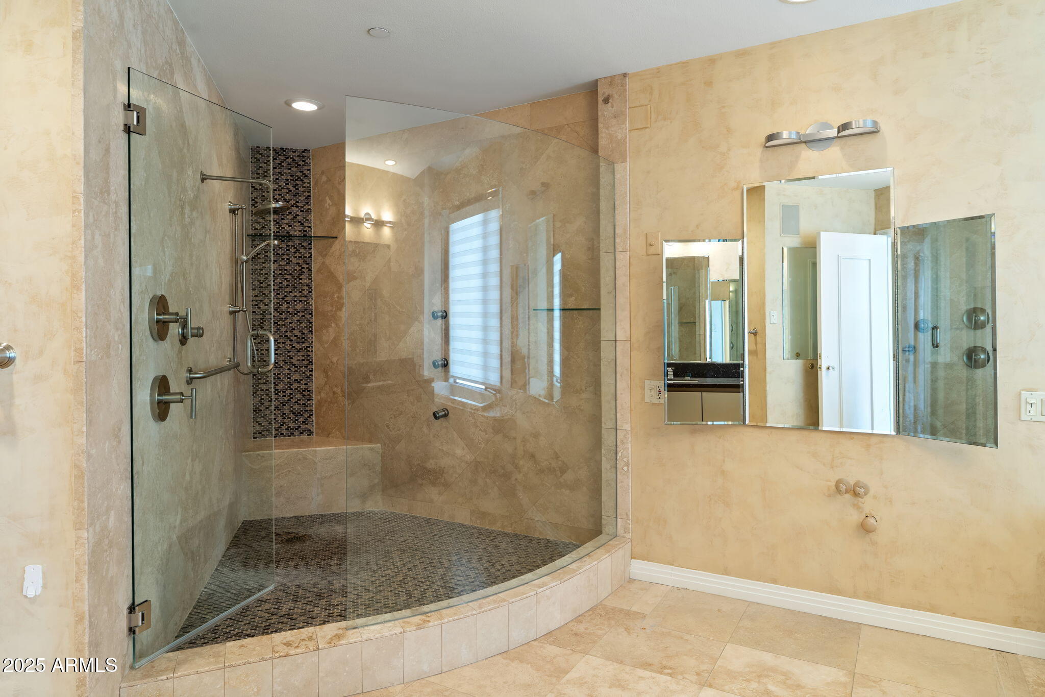 1040 East Osborn Road, Unit 1602 Phoenix, AZ 85014 - Photo 36 of 66 a bathroom with a shower and a bath tub