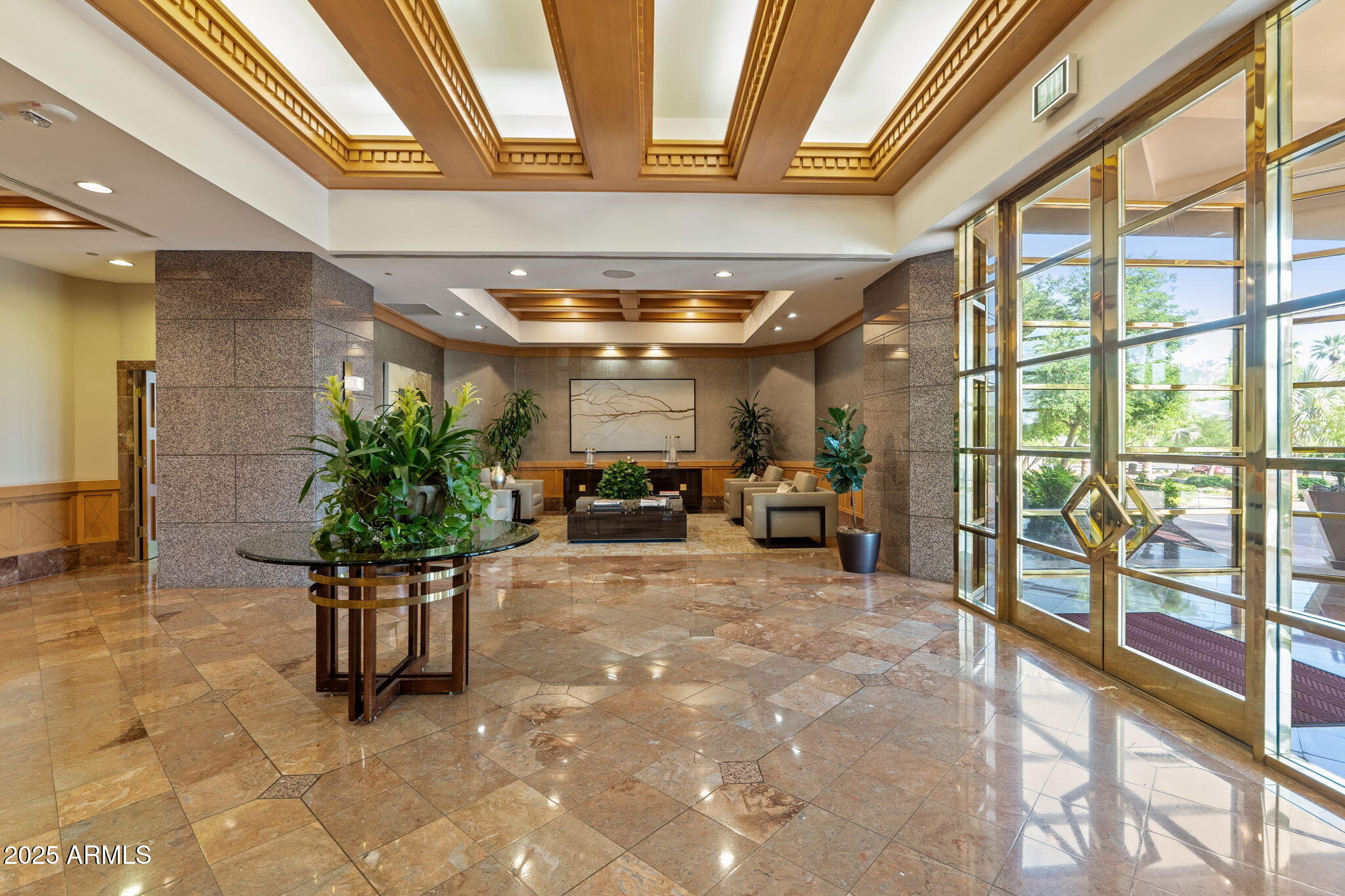 1040 East Osborn Road, Unit 1602 Phoenix, AZ 85014 - Photo 5 of 66 a living room with furniture and a potted plant
