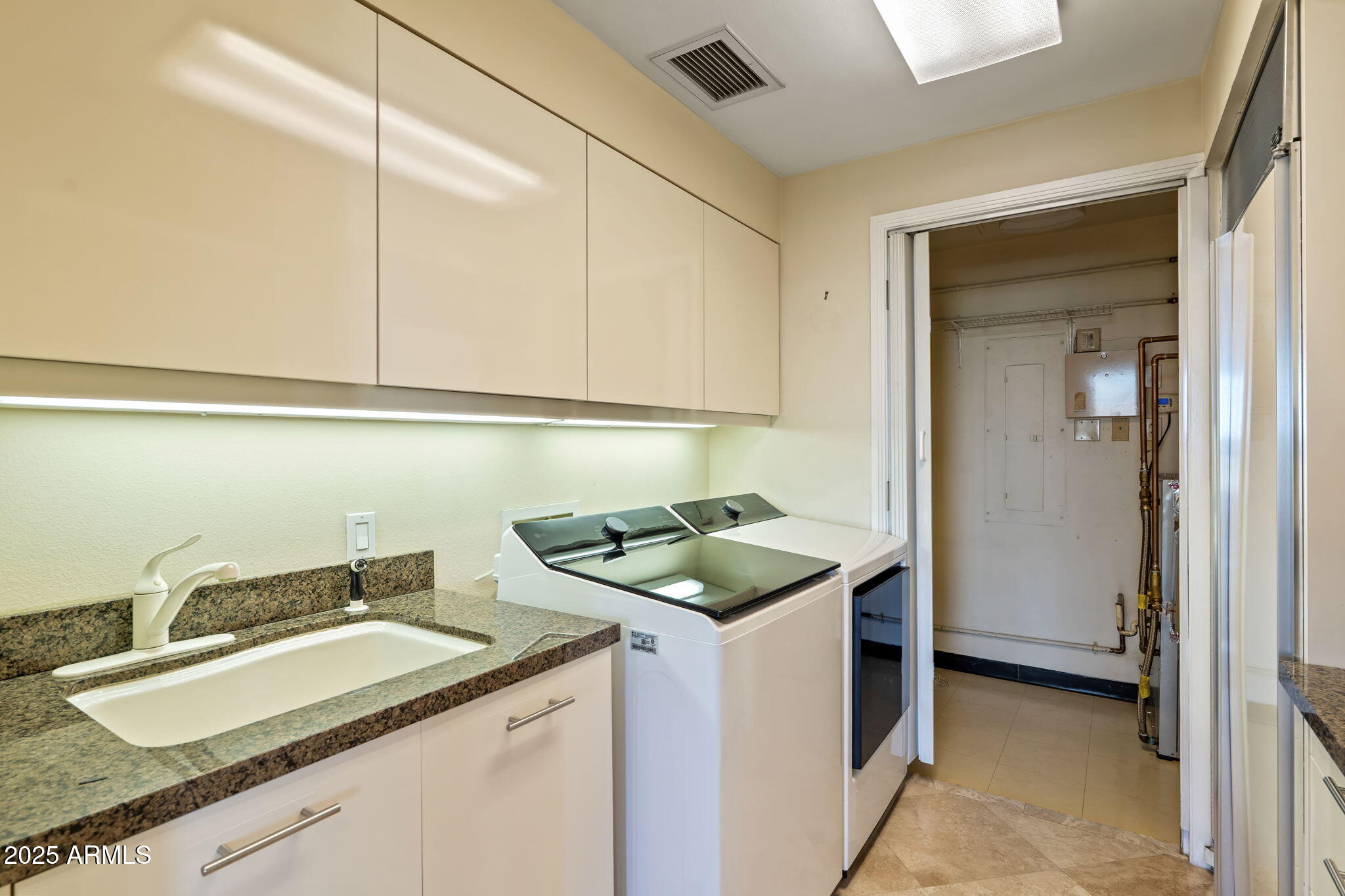 1040 East Osborn Road, Unit 1602 Phoenix, AZ 85014 - Photo 51 of 66 a kitchen with a sink and a stove top oven