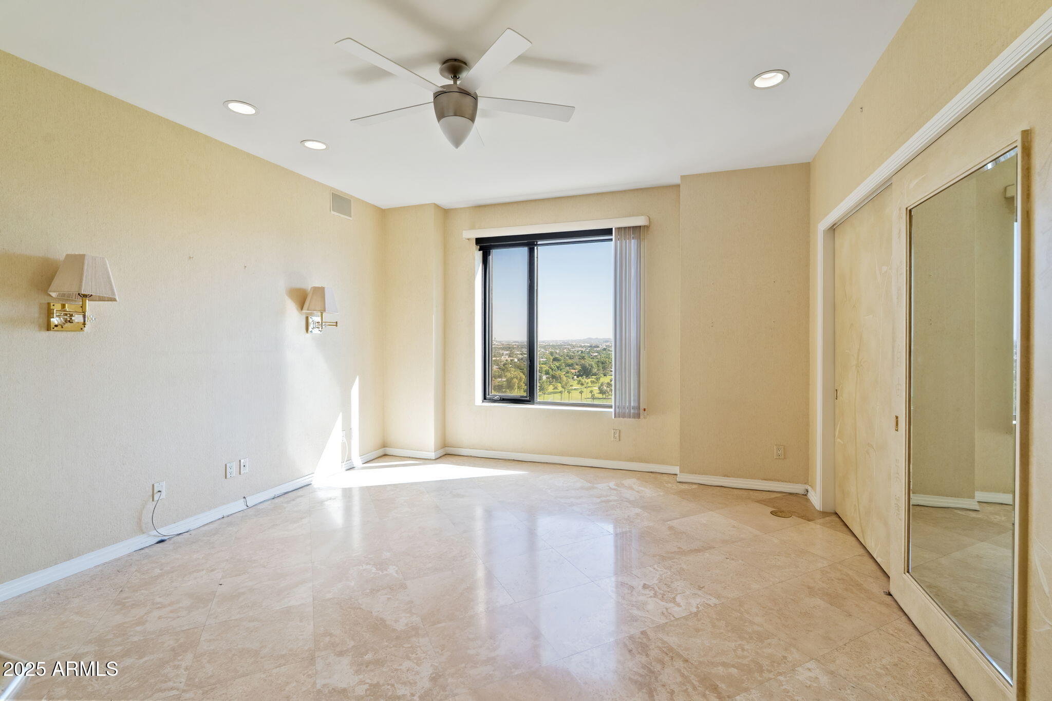 1040 East Osborn Road, Unit 1602 Phoenix, AZ 85014 - Photo 58 of 66 a view of an empty room with a window