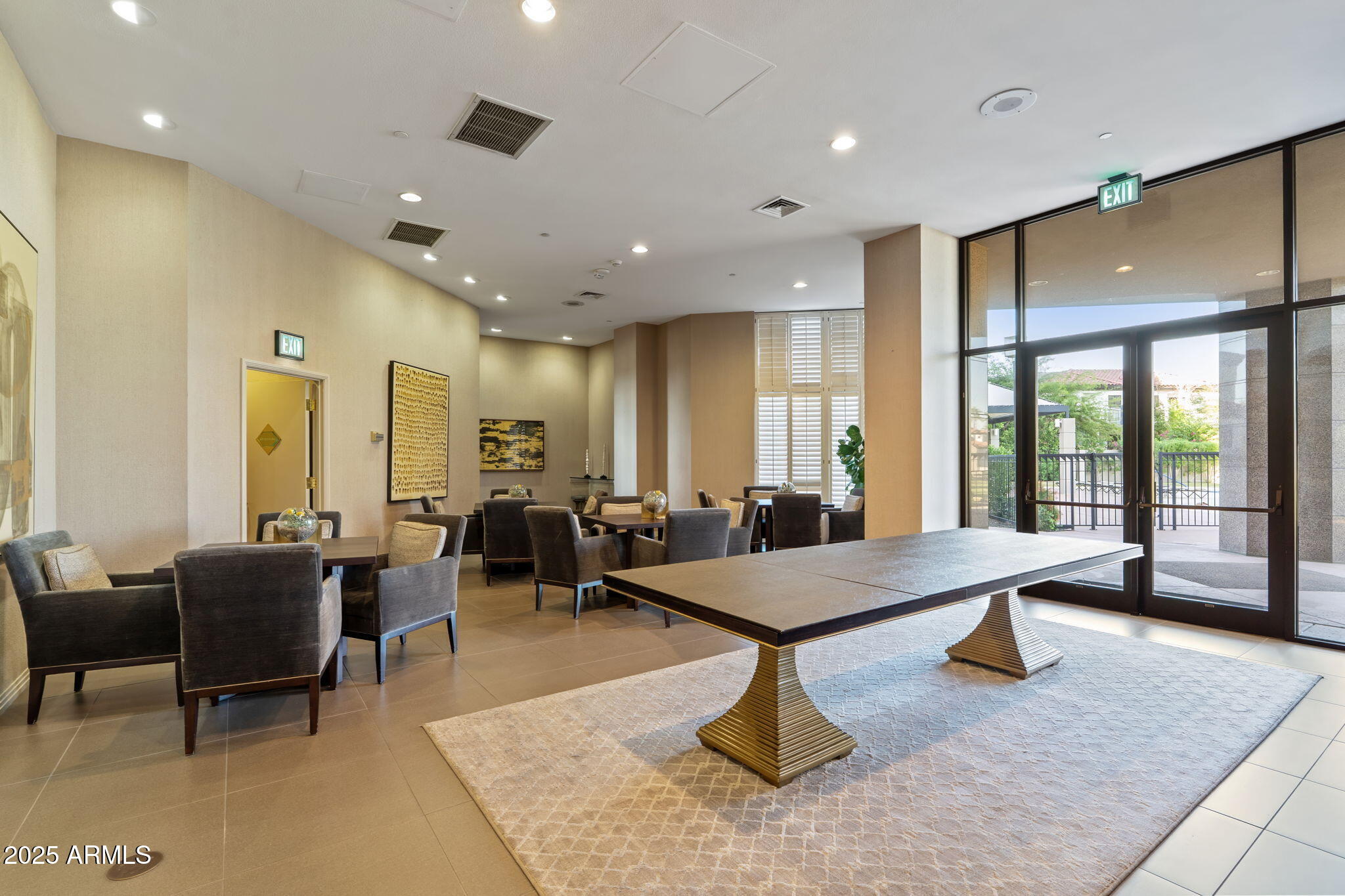 1040 East Osborn Road, Unit 1602 Phoenix, AZ 85014 - Photo 62 of 66 a large room with lots of furniture and a rug