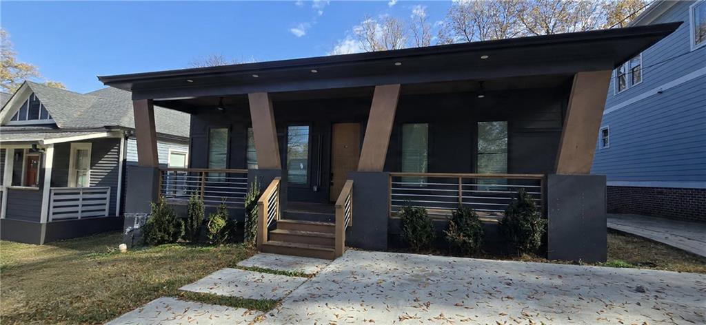 762 Cooper Street Southwest Atlanta, GA 30315 - Photo 1 of 43 a view of a house with entryway and wooden fence