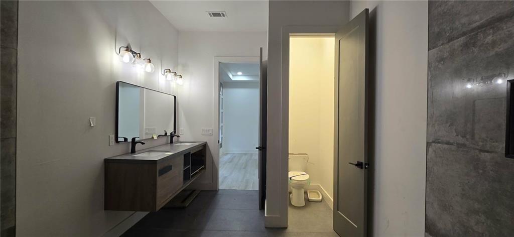 762 Cooper Street Southwest Atlanta, GA 30315 - Photo 15 of 43 a en suite bathroom with a sink and a mirror