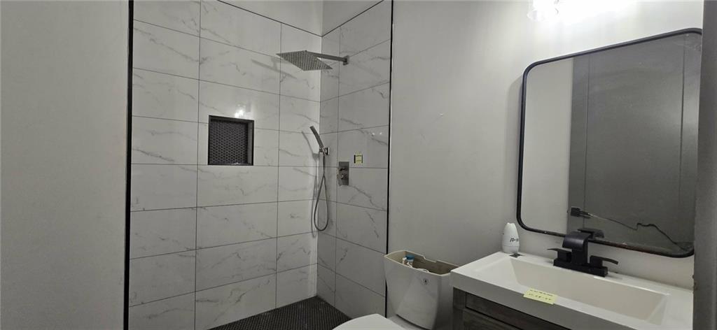 762 Cooper Street Southwest Atlanta, GA 30315 - Photo 17 of 43 a bathroom with a sink and a mirror