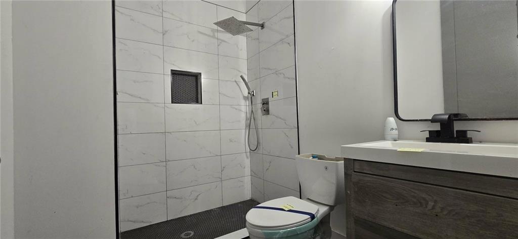 762 Cooper Street Southwest Atlanta, GA 30315 - Photo 19 of 43 a bathroom with a sink a toilet and shower