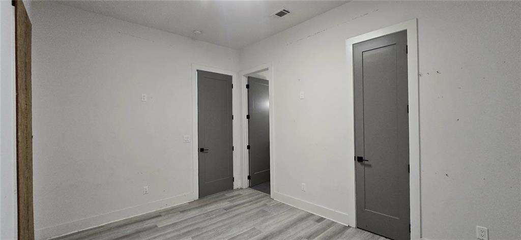 762 Cooper Street Southwest Atlanta, GA 30315 - Photo 29 of 43 a view of hallway with closet and wooden floor