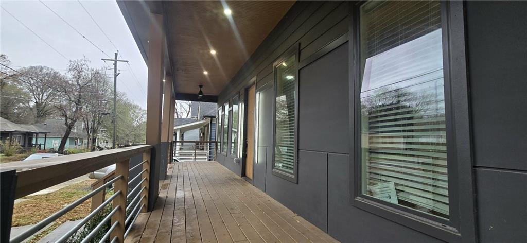 762 Cooper Street Southwest Atlanta, GA 30315 - Photo 3 of 43 a view of a balcony with wooden floor and door
