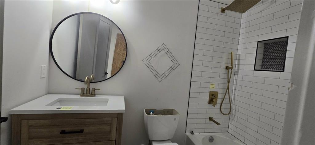 762 Cooper Street Southwest Atlanta, GA 30315 - Photo 35 of 43 a bathroom with a sink toilet and a mirror