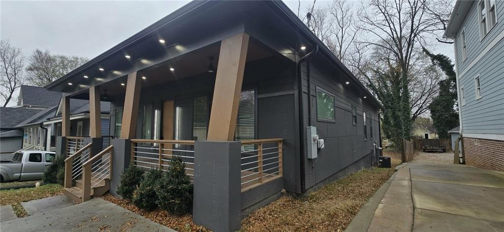 762 Cooper Street Southwest Atlanta, GA 30315 - Photo 4 of 43 a yellow house with trees in front of it