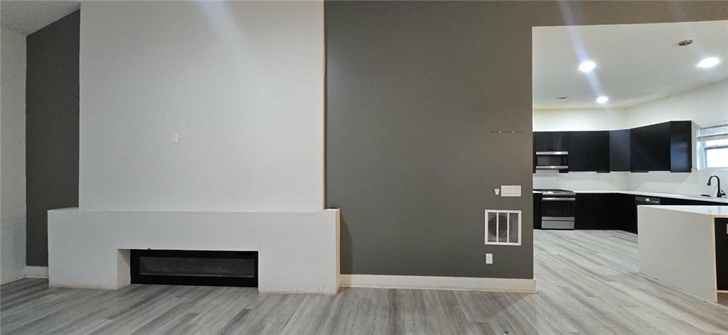 762 Cooper Street Southwest Atlanta, GA 30315 - Photo 6 of 43 a view of kitchen with furniture and wooden floor