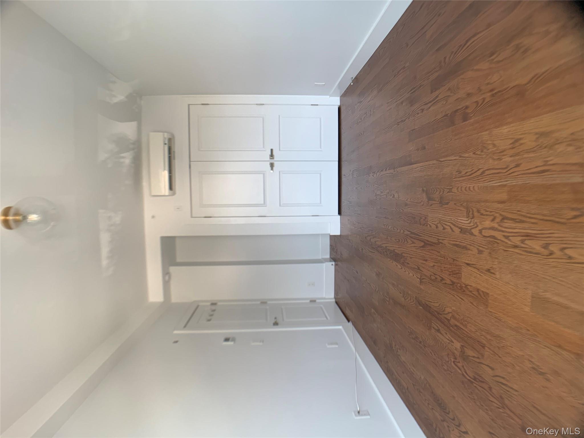 109-19 72nd Road, Unit 4C Queens, NY 11375 - Photo 15 of 16 wooden floor in an empty room