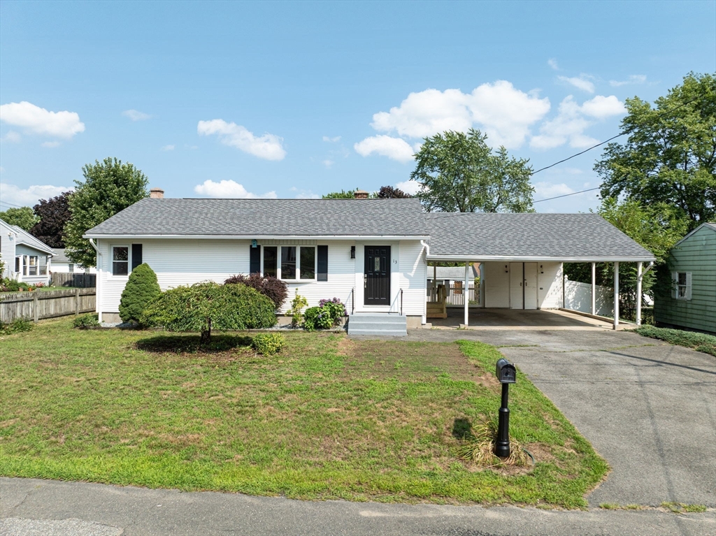 13 Lorimer Street Chicopee, MA 01013 - Photo 1 of 42 a front view of a house with garden