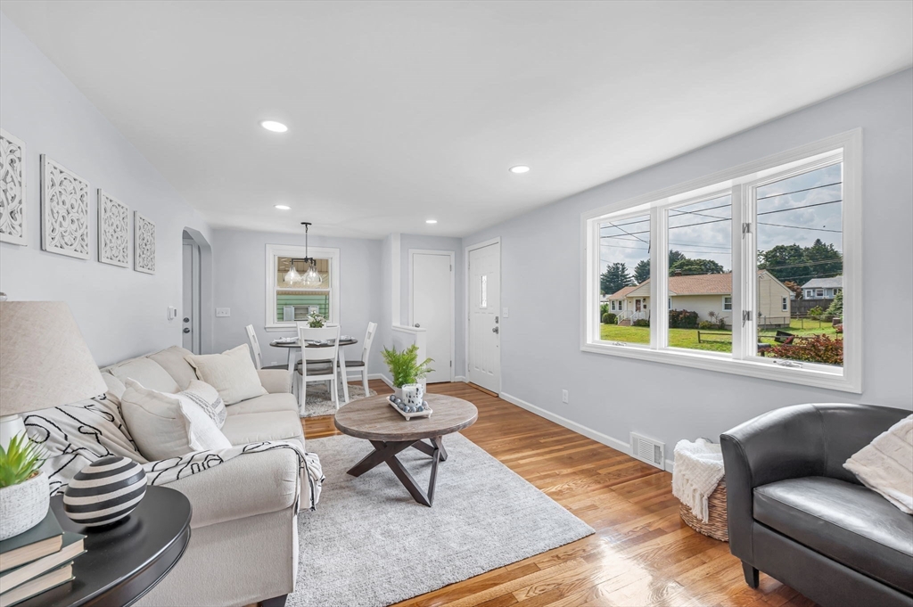 13 Lorimer Street Chicopee, MA 01013 - Photo 11 of 42 a living room with furniture and a window