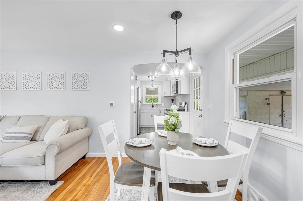 13 Lorimer Street Chicopee, MA 01013 - Photo 14 of 42 a living room with furniture and a chandelier