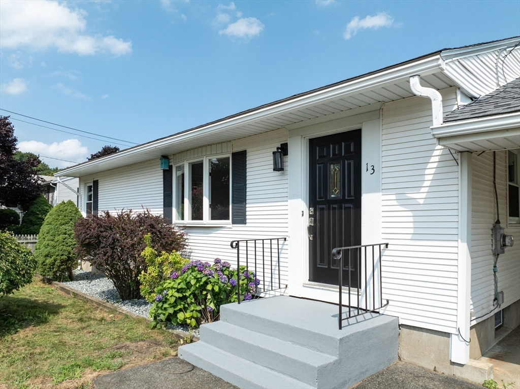 13 Lorimer Street Chicopee, MA 01013 - Photo 2 of 42 a front view of a house with garage