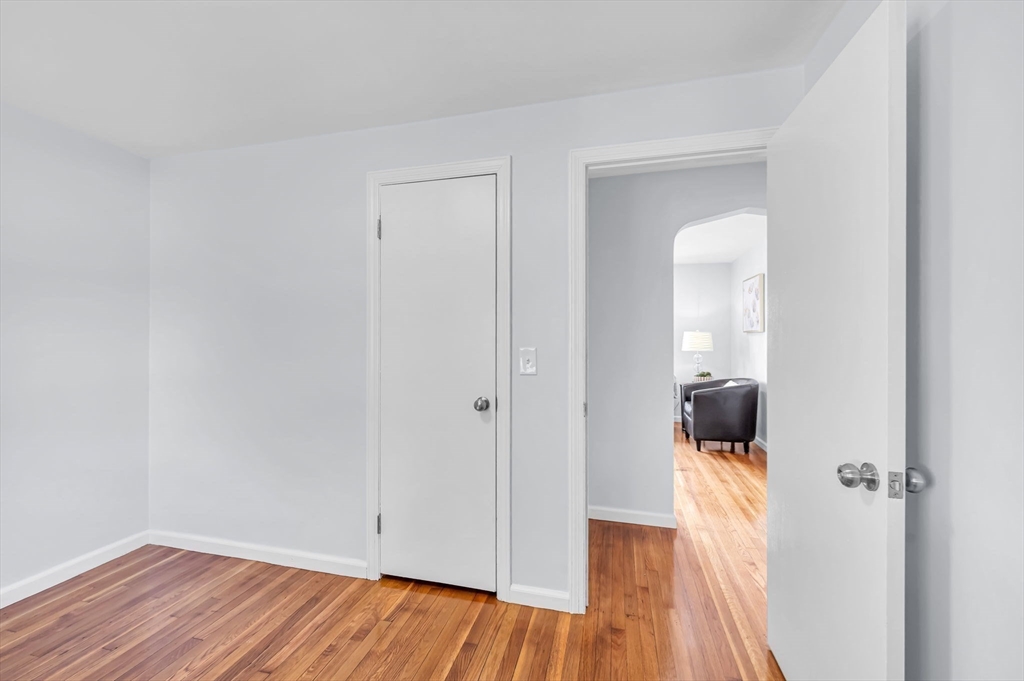 13 Lorimer Street Chicopee, MA 01013 - Photo 26 of 42 a view of a room that has a wooden floor