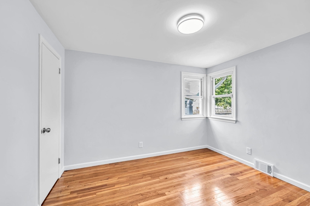 13 Lorimer Street Chicopee, MA 01013 - Photo 27 of 42 a view of empty room with wooden floor and fan