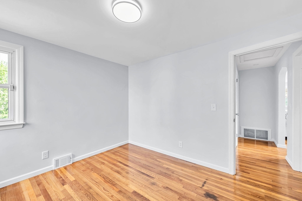 13 Lorimer Street Chicopee, MA 01013 - Photo 28 of 42 a view of empty room with wooden floor