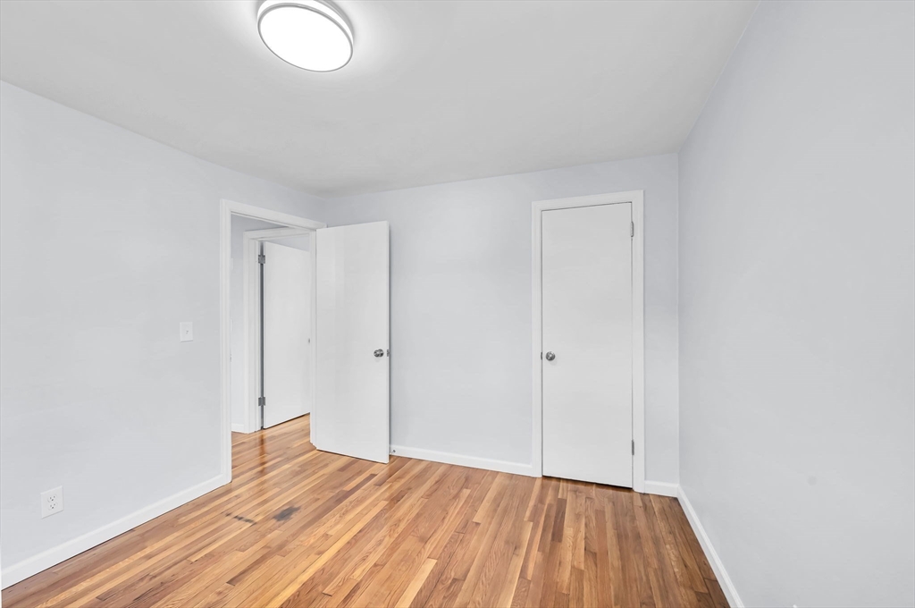 13 Lorimer Street Chicopee, MA 01013 - Photo 29 of 42 a view of room with wooden floor and fan