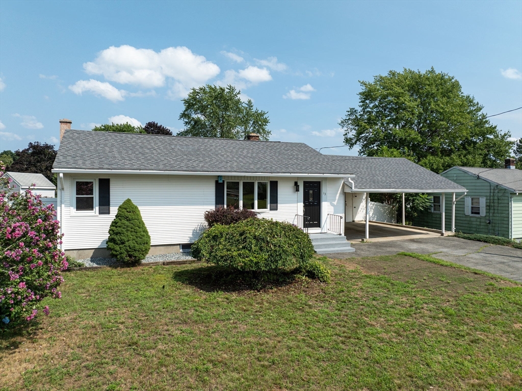 13 Lorimer Street Chicopee, MA 01013 - Photo 3 of 42 a front view of a house with garden