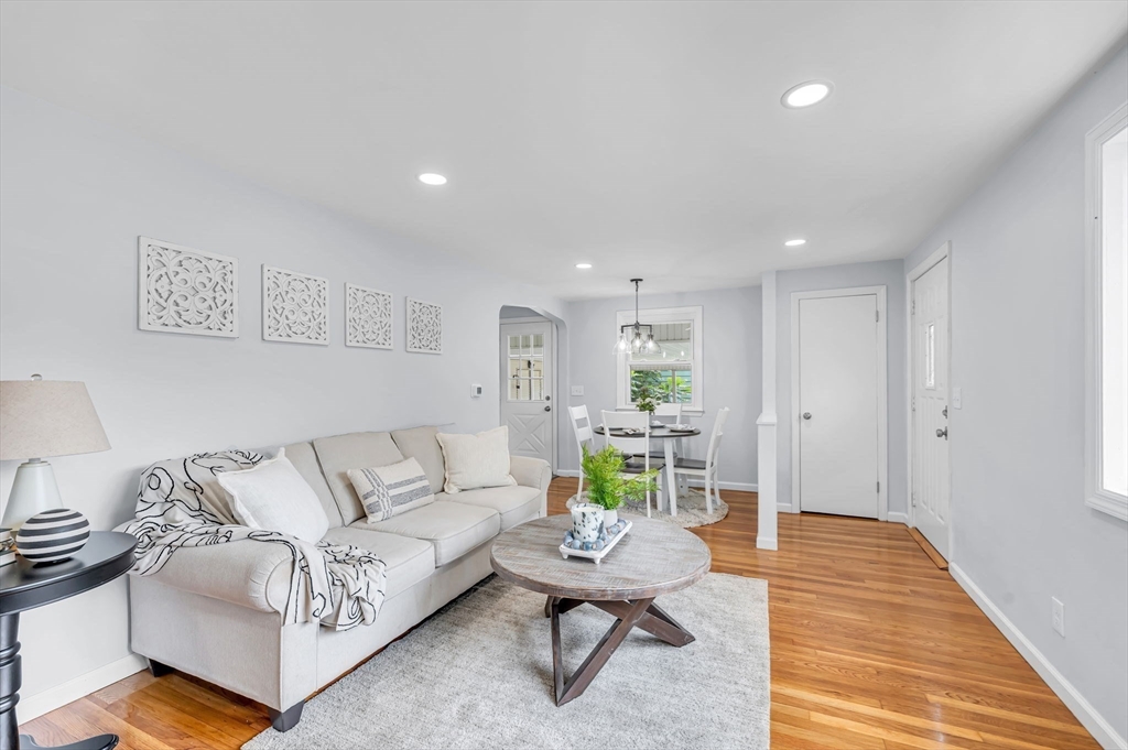 13 Lorimer Street Chicopee, MA 01013 - Photo 10 of 42 a living room with furniture and a wooden floor