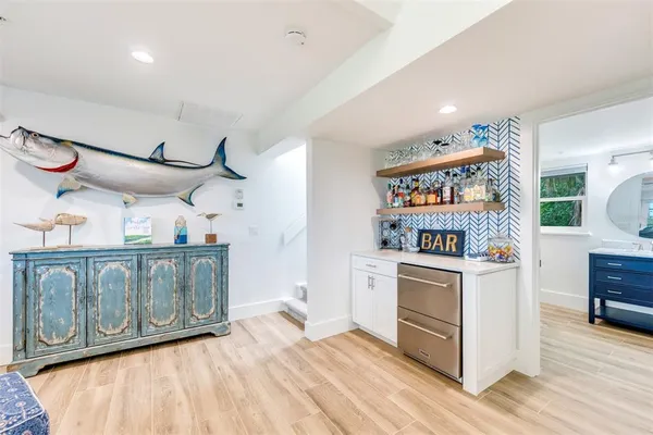 a kitchen with stainless steel appliances granite countertop a stove and cabinets