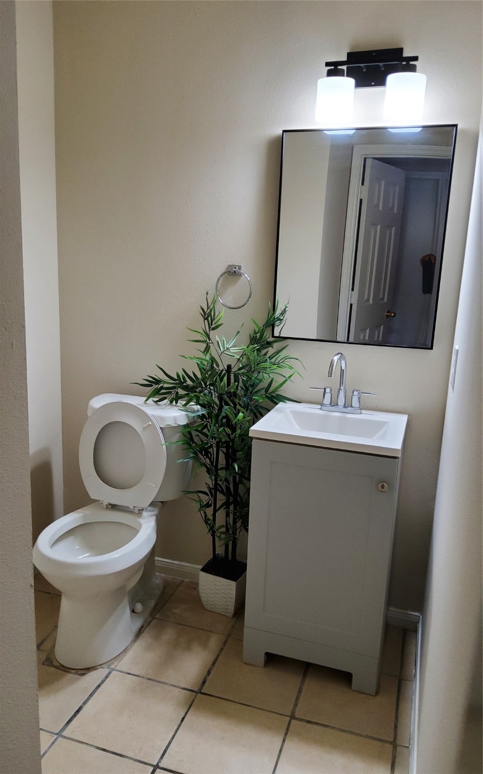 2906 Humble Drive Manvel, TX 77578 - Photo 29 of 34 a bathroom with a toilet sink and mirror