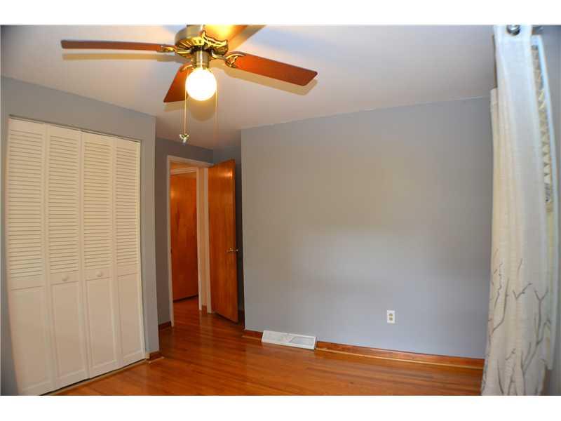 307 Foxcroft Road Pittsburgh, PA 15220 - Photo 6 of 23 Bedroom. SECOND FRONT BEDROOM WITH HARDWOOD AND WINDOW TREATMENTS