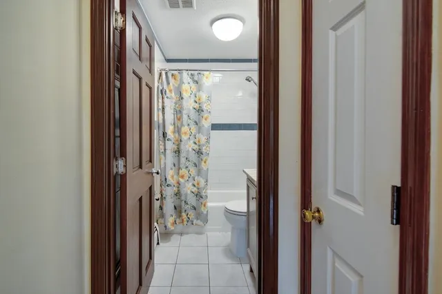 a view of a bathroom from a hallway