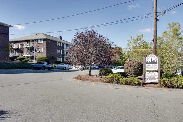 a view of a street with a building in the background