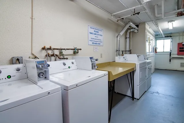 a view of a kitchen that has a sink and a stove in it