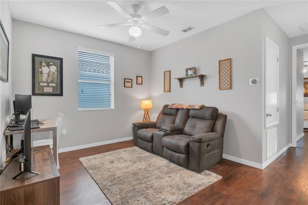 306 Reed Grass Drive Oviedo, FL 32765 - Photo 12 of 33 a living room with furniture and a wooden floor