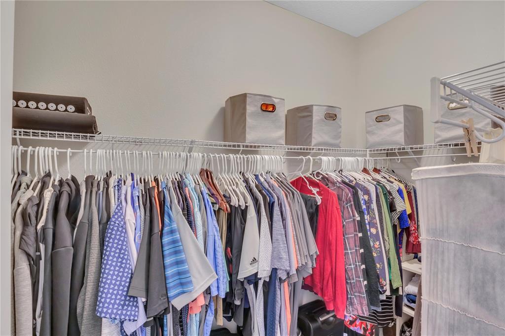 306 Reed Grass Drive Oviedo, FL 32765 - Photo 15 of 33 a view of walk in closet with clothes and shoes