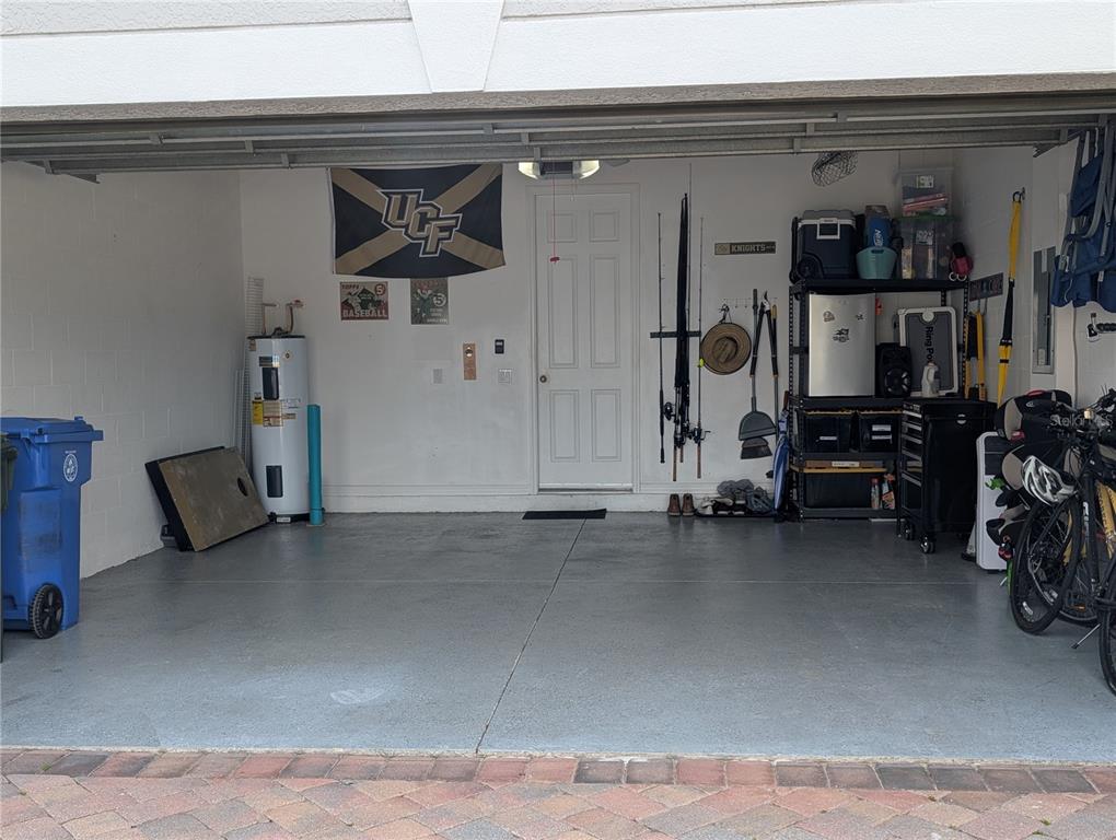 306 Reed Grass Drive Oviedo, FL 32765 - Photo 24 of 33 a view of a livingroom with gym equipment