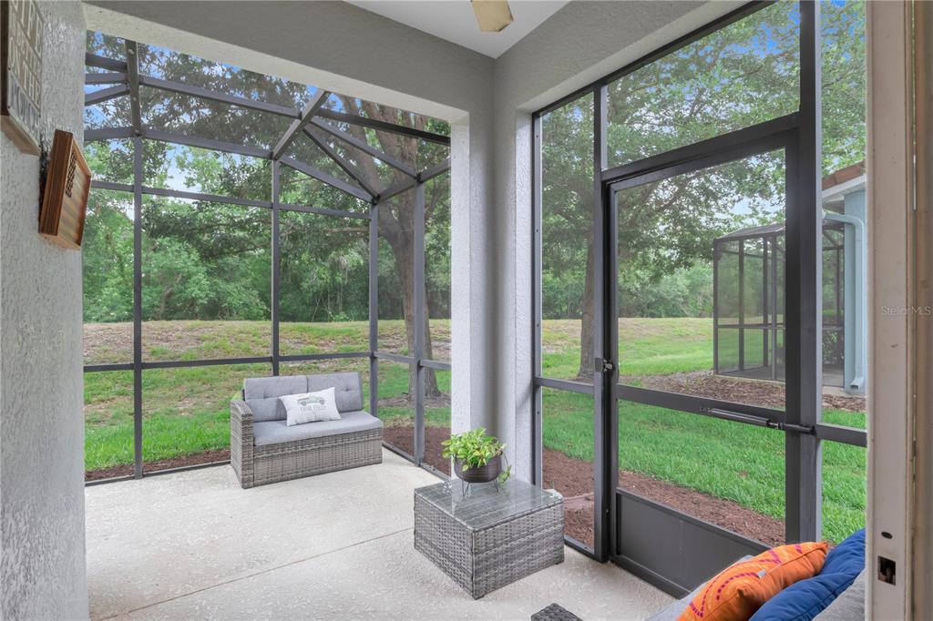306 Reed Grass Drive Oviedo, FL 32765 - Photo 25 of 33 a living room with couch and a floor to ceiling window