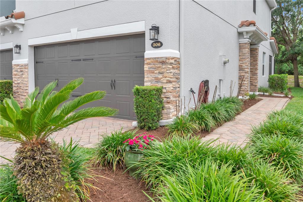 306 Reed Grass Drive Oviedo, FL 32765 - Photo 3 of 33 a front view of a house with garden