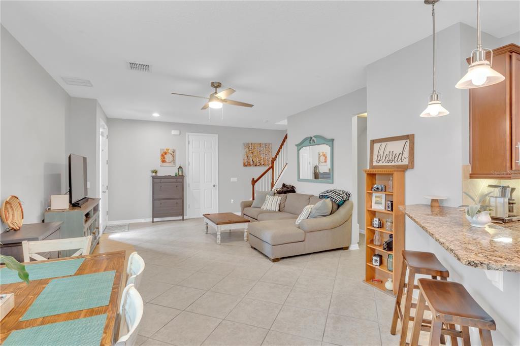 306 Reed Grass Drive Oviedo, FL 32765 - Photo 8 of 33 a living room with furniture and a flat screen tv